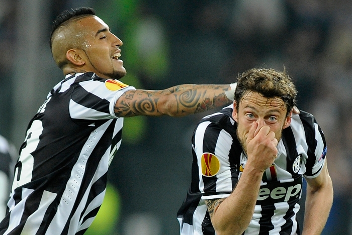 Juventus Claudio Marchisio (R) celebrates with teammate Arturo Vidal (L) after scoring against Olympique Lyon during the second leg of their Europa League quarter-final soccer match at the Olympic stadium in Turin.